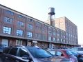 An older brick warehouse building with water tower